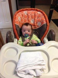 ...and then we had a dinner guest join us at the table!  Every night now, Lucas sits in his highchair at the table with us for dinner.  Not too long now and he'll get something other than milk