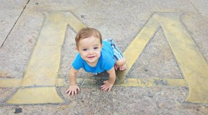 Looks like my adorable sidekick is enjoying the University of Michigan as much as his daddy does