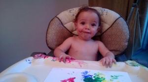 Three weeks wasn't enough travel, so we threw my sidekick and our dog in the car and drove to Chicago for the weekend. While we were there visiting the Gerstner family, Lucas got to finger paint for the first time. I think a little bit of paint even made it to the paper