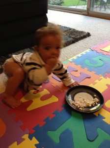 When daddy works late, this is what dinner looks like: cut up cheese sticks on the family room floor. At least I put it on a plate.