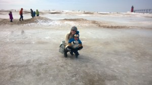 the black dots are people.  It's unreal how iced over the lake is.
